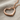 Open Heart Pendant, rose gold, angled product view on fabric