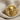 Jester Skull Ring, gold vermeil, angled product view on fabric