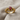 Bat Engagement Ring, gold vermeil, front view on textured cloth