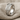 Cross Fleur de Lis Ring, polished silver, product photo on linen