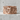 Howling wolf mountain ring, rose gold, product photo on stone ledge