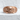 Ribbed Skull Crossbones Ring, rose gold, product photo on stone pedestal