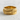 Warrior Spear Ring, gold vermeil, product photo on textured surface