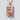 Fallen Soldier Dog Tag Pendant, rose gold, product photo on textured stone surface