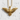 Detailed view of gold eagle pendant showing intricate wing feathers against textured white stone wall