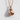 Tied Boxing Gloves Pendant, rose gold, product photo against textured wall