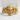 Mayan Mask Ring, gold vermeil, front view on stone surface