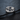 Sapphire Crater Ring, polished silver, front view on branch