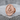 Past master lapel pin, rose gold, angled view on stone