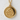 Gold dragon sigil disc necklace resting on a light textured stone background displaying fine craft details