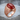 Oval Masonic Carnelian Ring, rose gold, side angle view on stone surface