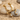 Moonstone Snake Drop Earring, gold vermeil, product photo on sand