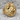 Facing Lovers Ring, gold vermeil, front view on stone surface