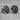 Forest Moon Wolf Cufflink, oxidized silver, front view on stone surface