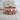 Catacomb skull ring in rose gold finish on stone background