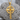 Beveled Celtic Cross Pendant, gold vermeil, product photo on textured stone