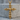 Multi skull cross pendant, gold vermeil, front product view on concrete