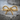 Rope Bow Knot Ring, gold vermeil, front view resting on stone