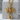 Gothic Skull Cross Pendant, gold vermeil, product photo on stone block