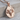 Aries Ram Zodiac Pendant, rose gold, product photo on wood display