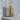Vitruvian Man Earring in gold vermeil on porous display block