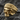 Ribbed Beanie Skull Ring, gold vermeil, angled front view on rock