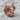 Thorn Crowned Jesus Ring, rose gold finish on stone surface
