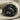 Saint John Eagle Ring, black rhodium plated, front view on fabric