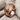 Layered Dragon Scale Ring, rose gold, angled view on fabric