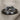 Infinity Knot Loop Ring, black rhodium plated, front view on linen