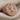 Saint Rose of Lima Ring, rose gold plated, angled front view on fabric