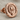 Hittite Sun Disk Earring, rose plated silver, angled front view
