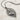 Skeleton leaf moth pendant, oxidized silver, product photo on stone