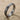 Hammered Posy Ring, oxidized silver, angled product view on sand