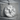 Bull Medallion Pendant, polished silver, front view on stone pedestal