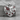 Cracked heart pendant, polished silver, product photo on stone
