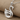 Floating Swan Pendant, polished, angled view on stone