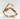 Reaching Skeleton Hands Ring, gold vermeil, product view on stone surface