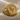 Aquarius Skull Ring in gold vermeil, angled product view on fabric