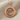 Hittite Sun Standard Pendant, rose gold, product photo on fabric
