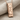 Luwian Life Pendant, rose gold, angled product photo on fabric