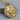 Twin Wolves Pendant, gold vermeil, product photo on wood surface