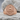 Amor Fati Signet Ring, rose gold finish on stone surface