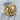 Fleur-de-Lis Tiger Ring, gold vermeil, front view on wood surface