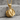 Snare Drum Pendant, gold vermeil, angled product photo on stone