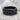 Skull Eternity Ring, black rhodium, resting on stone