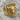Bull Signet Ring, gold vermeil, angled view on rock surface