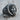 Scroll Jesus Christ Ring, oxidized silver, three-quarter view on wood