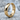 Faceted Geometric Hoop Earring, gold vermeil, product photo on stone