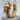 Catacomb Skull Hoop Earring, gold vermeil, angled side view on rock